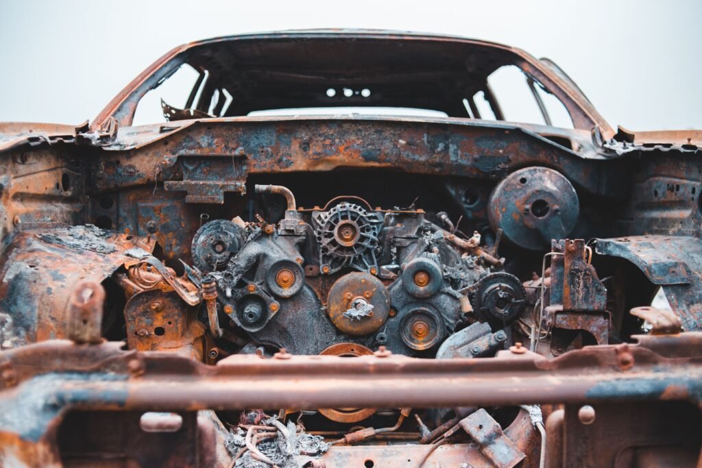 Rusty damaged car prepared for scrap and recycling
