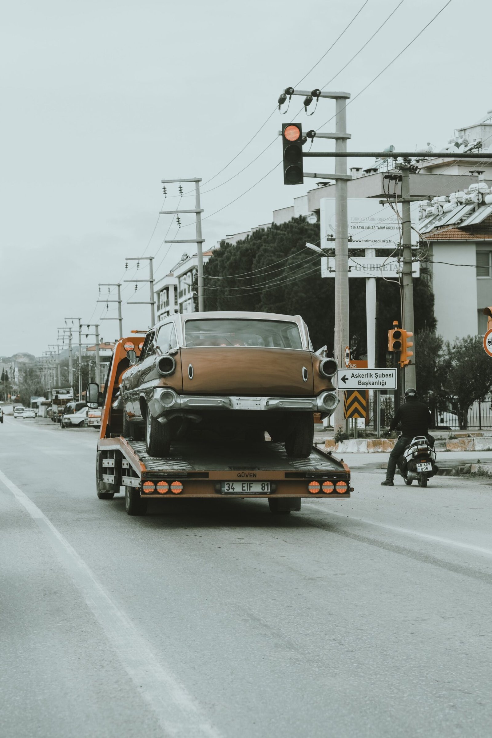 Tow truck removing a junk car for recycling in Metro Vancouver
